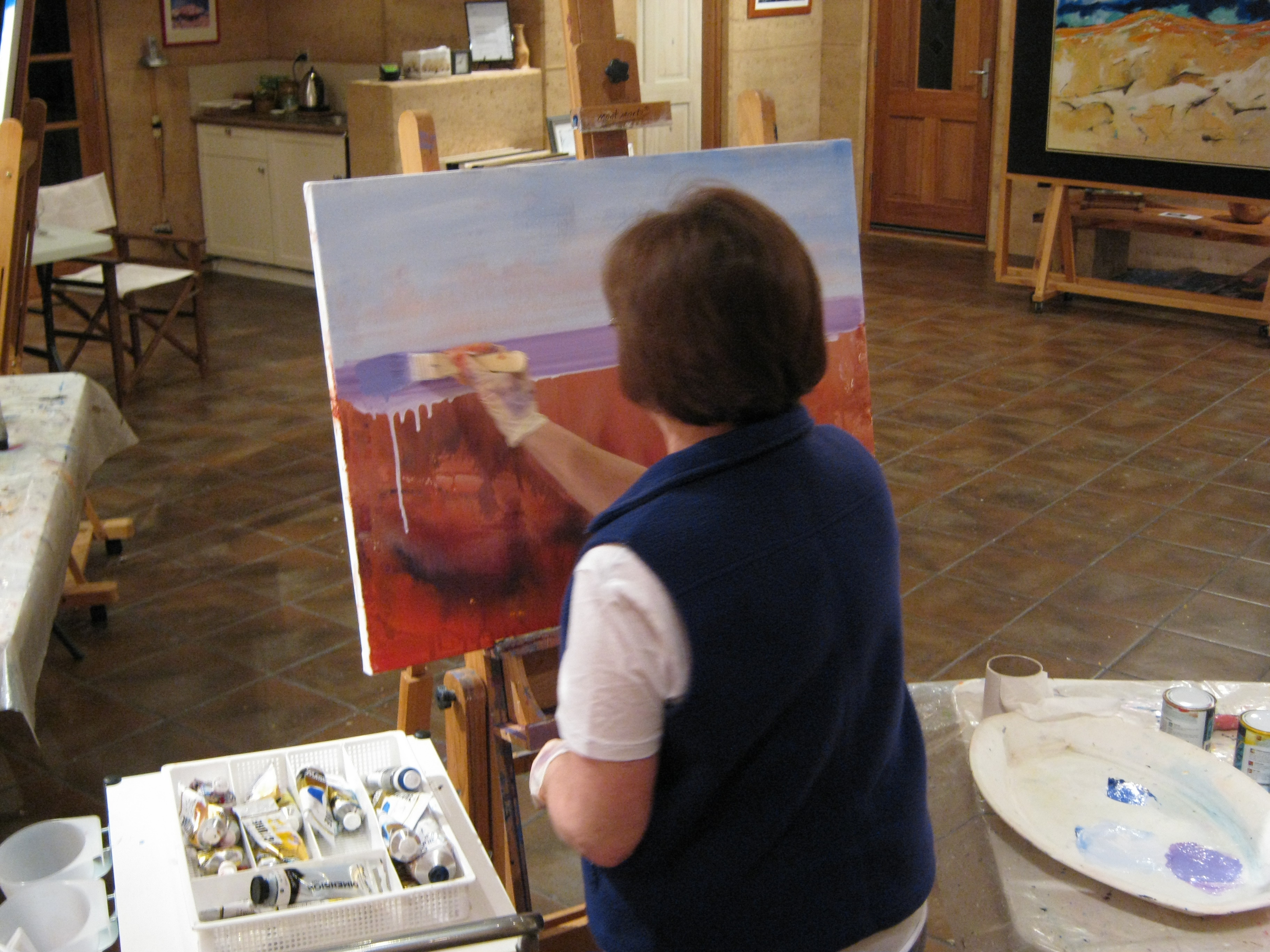 HELEN HAYWARD WORKING ON AN ACRYLIC PAINTING